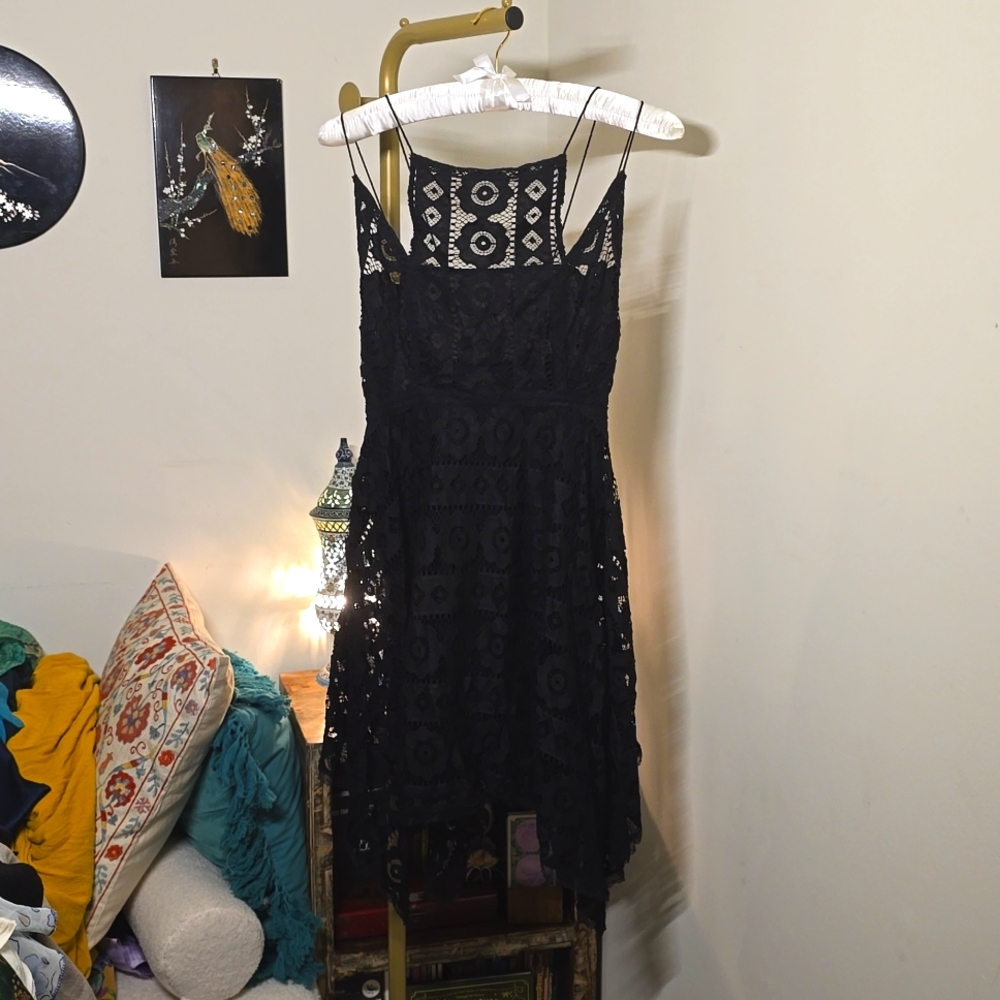 Strappy lacy dress with handkerchief hem
